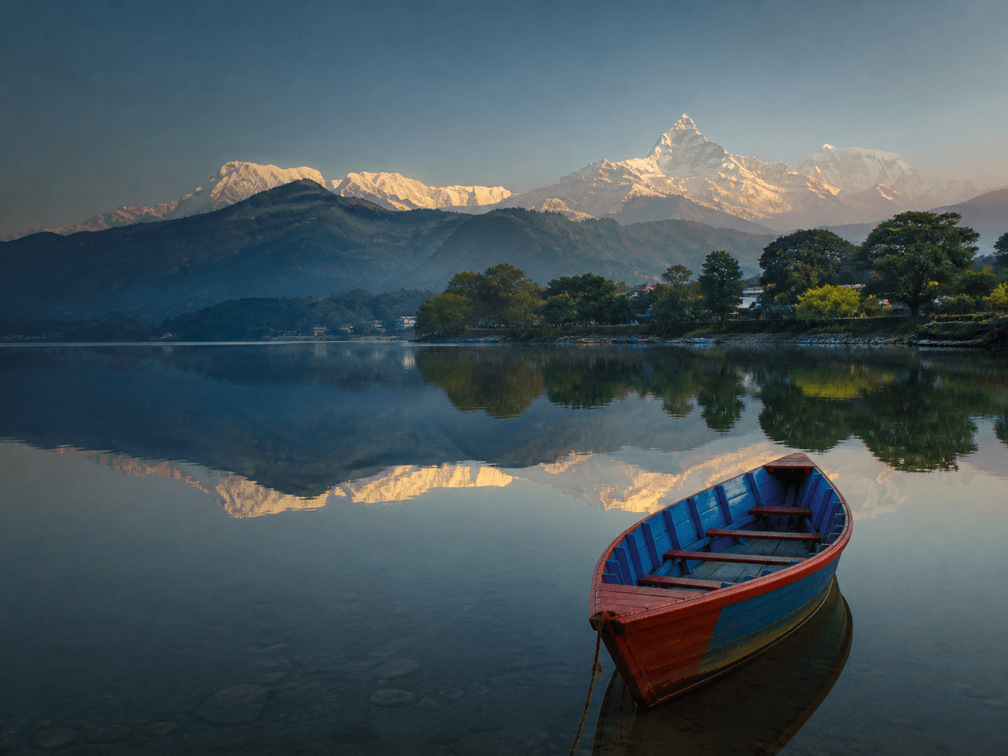 A calm lake and mountain landscape in Pokhara